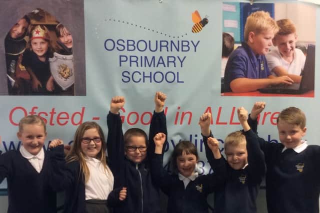 Osbournby School pupils celebrate being graded good in all areas by Ofsted. EMN-161220-171754001
