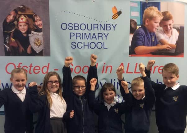 Osbournby School pupils celebrate being graded good in all areas by Ofsted. EMN-161220-171754001