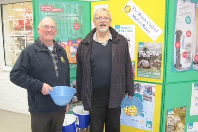 Rotarians Tony Maund and Keith Allen collecting at The Co-op in Market Rasen. EMN-161228-140701001