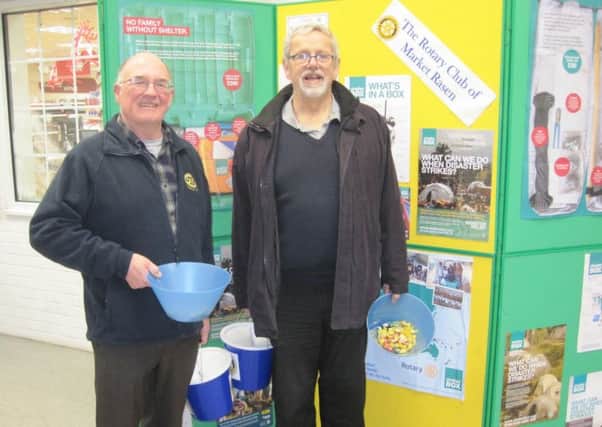 Rotarians Tony Maund and Keith Allen collecting at The Co-op in Market Rasen. EMN-161228-140701001