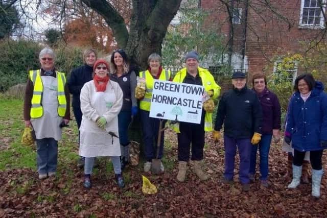 These volunteers planted bulbs in Horncastle but a town councillor would like to see more people come forward.