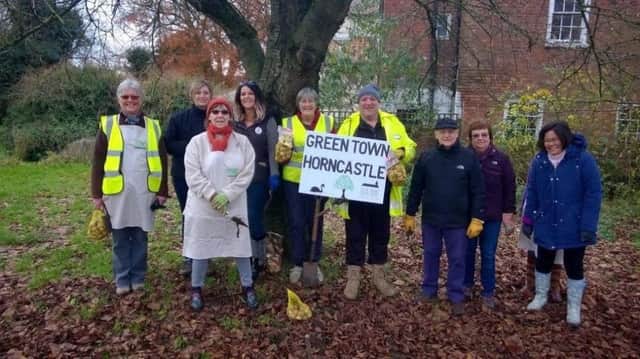 These volunteers planted bulbs in Horncastle but a town councillor would like to see more people come  forward.