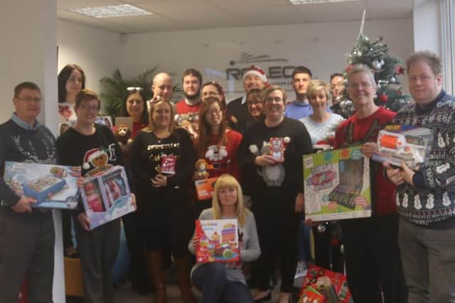 Staff af Rolec, in Frampton, during their Christmas goodwill drive.