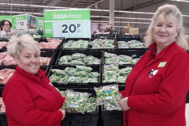 Asda store assistant Vanessa Jackson, who appears in the sprout video, with service section leader Jane Hayford and some of the veg being sold by the store.