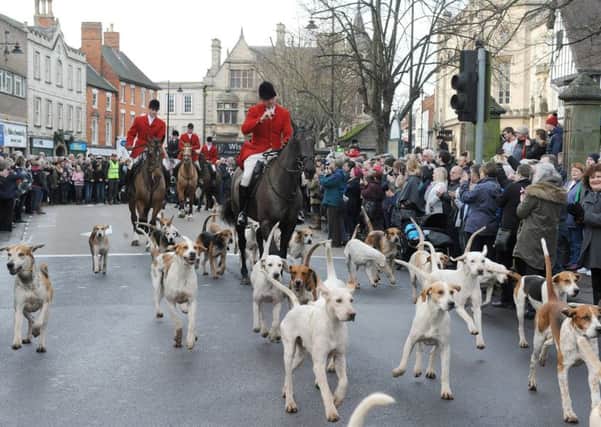 Blankney Hunt meet in Sleaford Market PLace. Riding out of the market place. EMN-161223-142843001