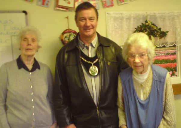Mayor John Matthews with two residents of The Poplars Care Home, which he visited on Christmas Day EMN-161226-085948001
