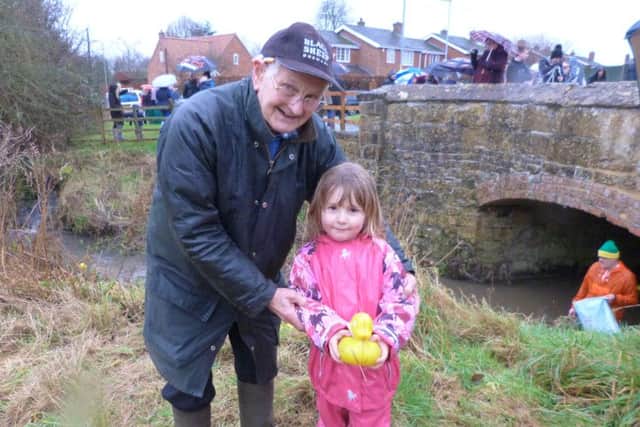 Ziva Chiltern holding the winning duck with President Alan Pennell. EMN-170201-185200001