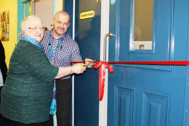 Olive Besant-Groom and Steve Roberts cutting the ribbon to officially open the new suite.
