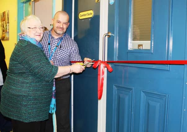 Olive Besant-Groom and Steve Roberts cutting the ribbon to officially open the new suite.