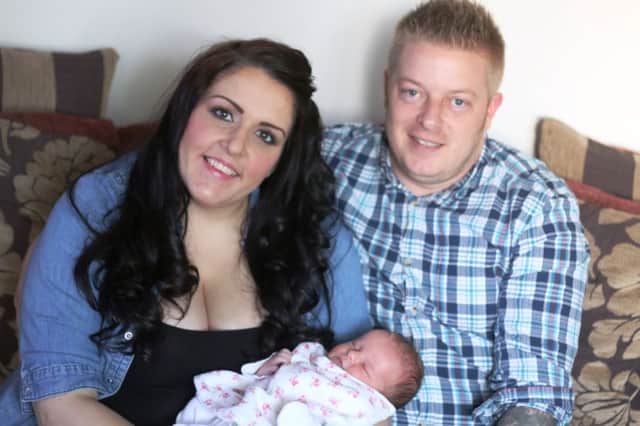 Bobbie Wright and Dean Hutchinson, pictured with their miracle baby Aurelia.