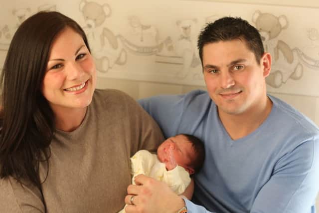 Sarah and Nick Havrey pictured with baby Austin. Photo: Chloe West.