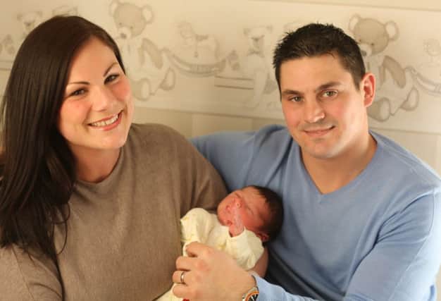Sarah and Nick Havrey pictured with baby Austin. Photo: Chloe West.