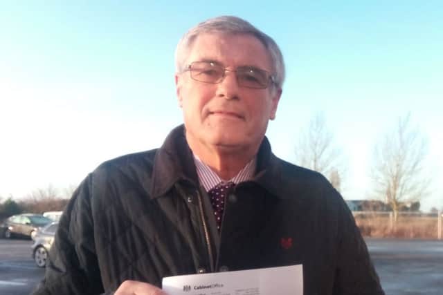 Chris Cook with his OBE letter of confirmation.