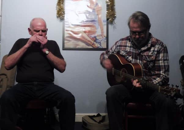 Barry Forbes and John Hubbert will play a mix of authentic blues and their own music. EMN-170201-140053001