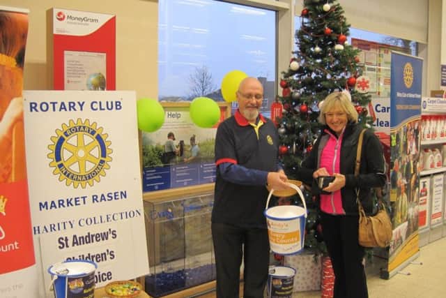 Rotarian John Moore and a kind, gererous contributor at Tesco EMN-170401-072018001