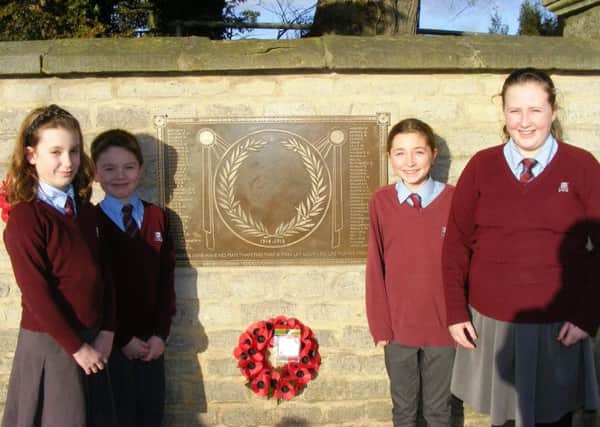 The plaque in memory of William Alvey School's 72 fallen war heroes has been installed. Pictured with it are members of the school's Bluey Club for children from RAF families. From left - Grace Gordon, Casper Jackson, Erin Clifford and Chloe Scrafton. EMN-170501-173437001