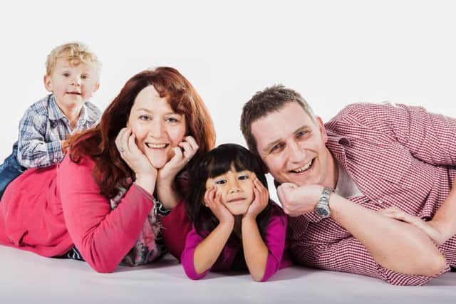 Louise Timmins, the UK volunteer head of Brighter Future, with husband Paul and their children, Marika and Finn.