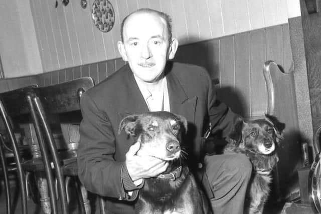 Whiskey (front) and his four-year-old son Major with Mr G. Symonds.