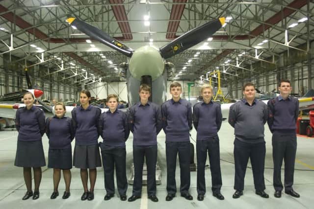 Members of Market Rasen ATC in front of a Spitfire at RAF Coningsby. EMN-170501-164003001