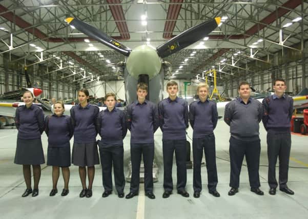 Members of Market Rasen ATC in front of a Spitfire at RAF Coningsby. EMN-170501-164003001