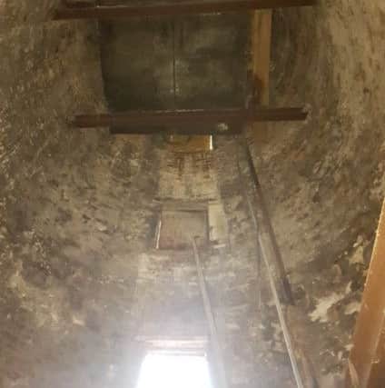 Inside the mill, with no floors left, just the water tank EMN-170901-093304001
