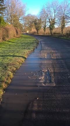 Main Road in Belchford where  water-filled pot-holes are often a hidden danger to  drivers.
