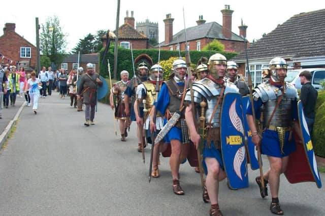 A re-enactment group marches to Tinkers Green iduring Burgh le Marsh Canival in July 2012. Photo: Eileen Chantry ANL-170117-080012001