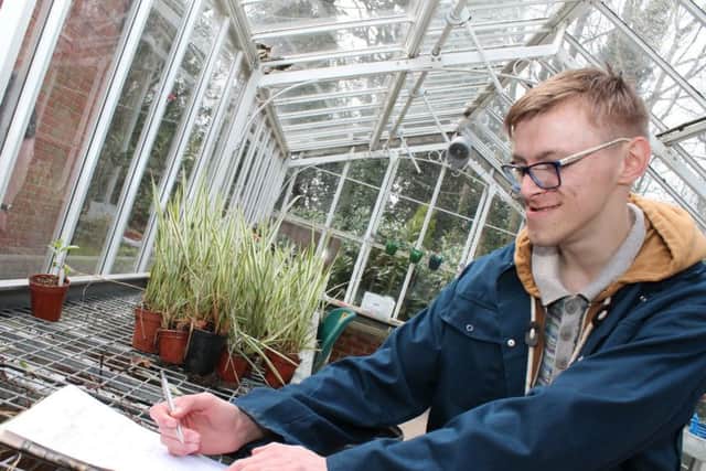 Linkage College student, Sam Parkin, 20, identifying equipment used in a horticultural work setting. EMN-170113-165203001