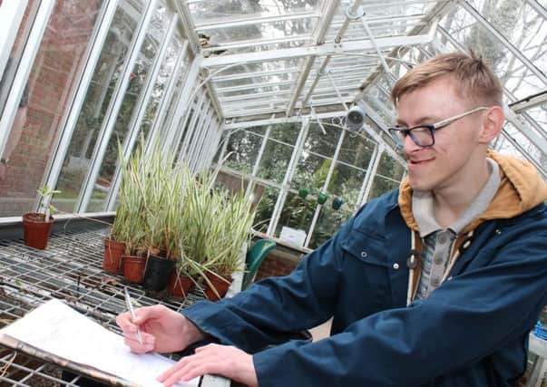 Linkage College student, Sam Parkin, 20, identifying equipment used in a horticultural work setting. EMN-170113-165203001
