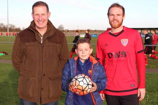 Match ball sponsor for the second half of the season, Michael Hix of The Four Seasons Garden Centre with son George and Sleaford Sports Amateurs captain Olly Sidney.