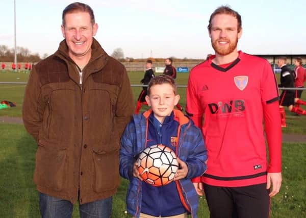 Match ball sponsor for the second half of the season, Michael Hix of The Four Seasons Garden Centre with son George and Sleaford Sports Amateurs captain Olly Sidney.