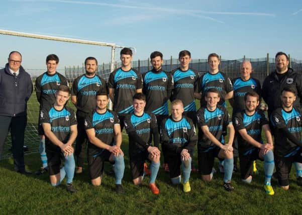 Leverton Sheepgate FC have taken stock of their new training kit. Pictured presenting the squad with their gear is Jack Fairman of sponsors Poyntons (left). s04Mc-Gsq2Qy-dMdcq0Y