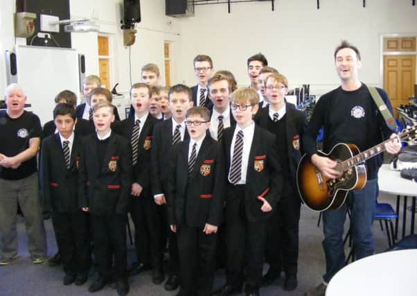 Johnny Dowd and Steve Mclelland of the Band From County Hell recording with Carres school choir. EMN-170113-170231001