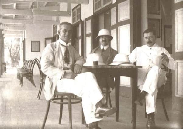 Harry Quiningborough (left) on the veranda of the Penang Club in 1912.