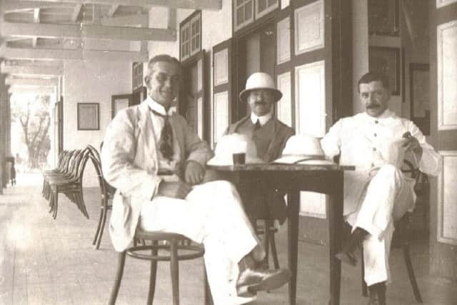 Harry Quiningborough (left) on the veranda of the Penang Club in 1912.