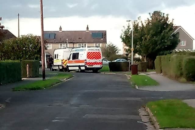 Police operational support vans and a dog unit attend an address on Princess Square in Billinghay in relation to the firearms threat incident. EMN-171101-154013001