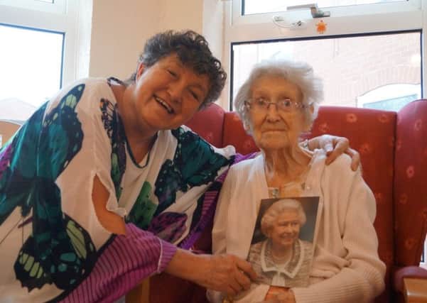 Centenarian Nancie Stonehouse and her daughter Linda EMN-170122-192531001