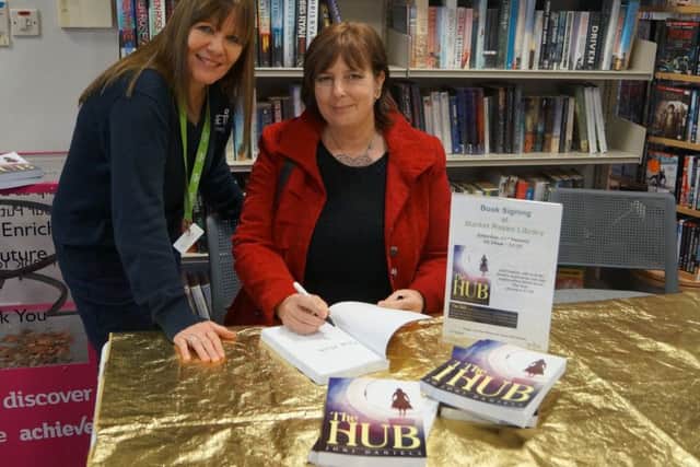 Author of The Hub Joni Daniels and librarian Mel Fenwick EMN-170122-195835001