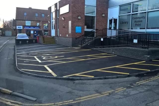 The re-surfaced car park bays outside the  towns  library
