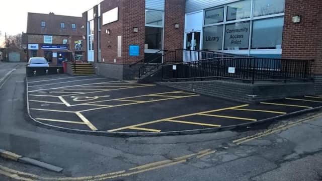 The re-surfaced car park bays outside the  towns  library