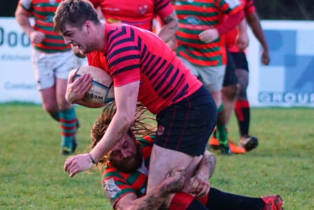 Jake Pryer makes a tackle against title-challenging Newbold EMN-170116-102153002