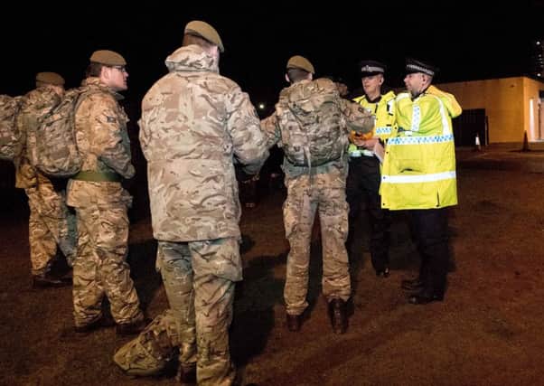 Soldiers and Police work together to warn residents of the risk of flooding.  All images remain Crown Copyright.  Photo credit: Cpl Georgina Coupe