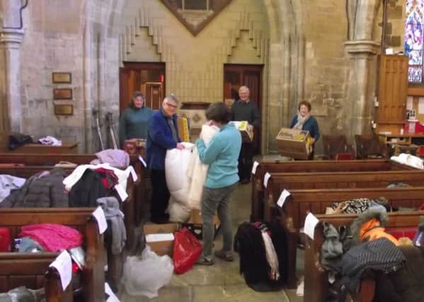 Sorting through the donations for Samara'a Aid at Horncastle St Mary's EMN-170113-075452001