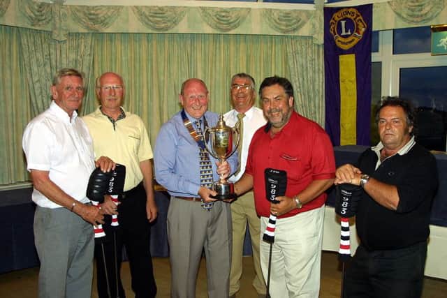 The Rockers take their prize in June 2004.
