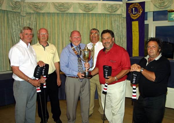 The Rockers take their prize in June 2004.