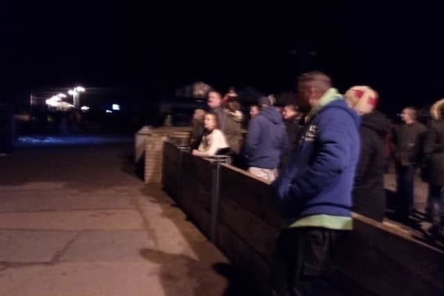 Crowds await the storm surge in Skegness. ANL-170113-192144001