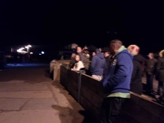 Crowds await the storm surge in Skegness. ANL-170113-192144001