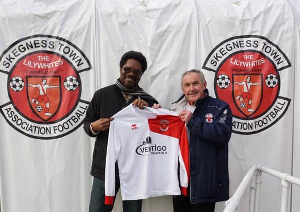 The Lilywhites kit is presented to Dr Bola Taiwo (left) by Skegness Town club secretary Allan Gray.