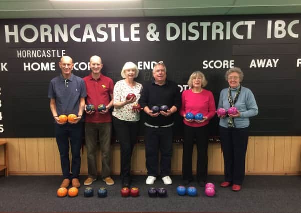 Pictured are some of Horncastle Bowls Club's newest members, pictured with some of the new coloured bowls the club have purchased.