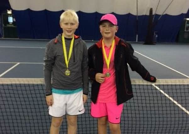 Will Cheer and Seth Briggs-Williams are seen with their medals for winning the Grade Three doubles at Easton College.